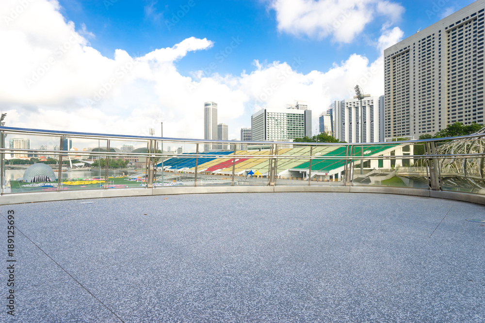 empty footpath and modern buildings near water