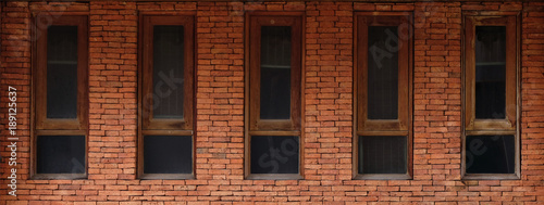 old wooden window frames with red bricks wall, background