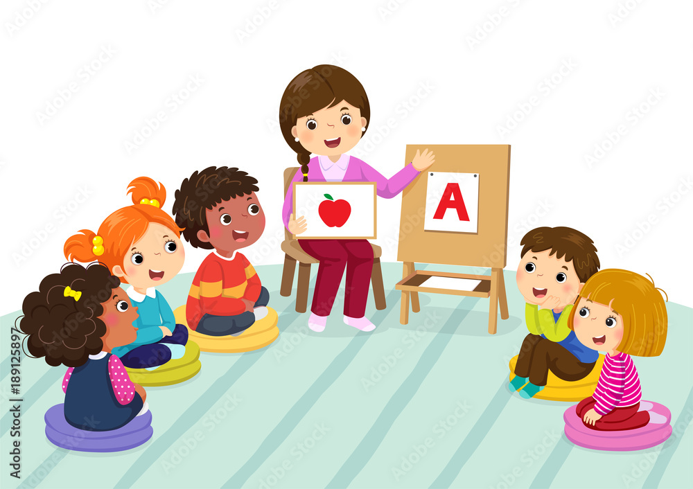 Group Of Preschool Kids And Teacher Sitting On The Floorteacher