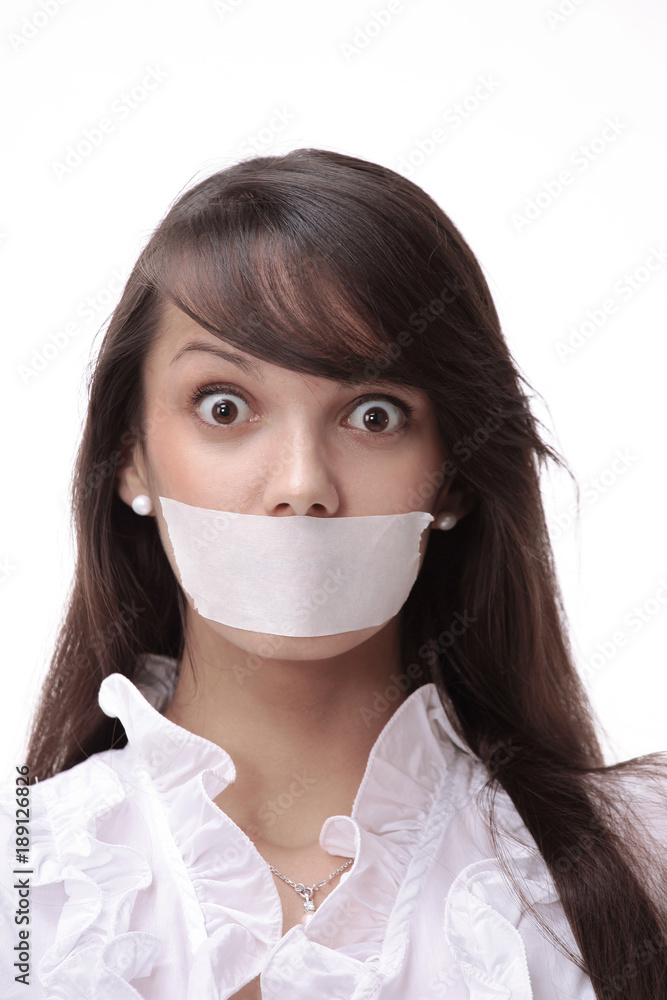 portrait of young business woman with taped mouth portrait of young business woman with taped mouth