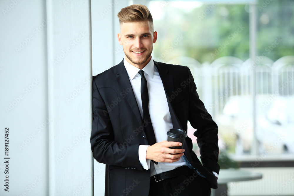 Portrait of a businessman looking at the window. Portrait of a businessman looking at the window.