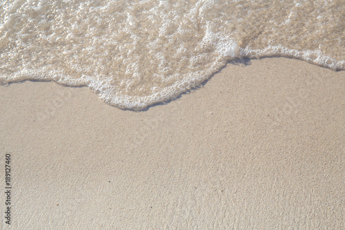 The movement of the waves on the sand is smooth and fine for background,Soft focus
