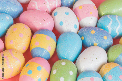Colorful easter eggs on pastel color background.