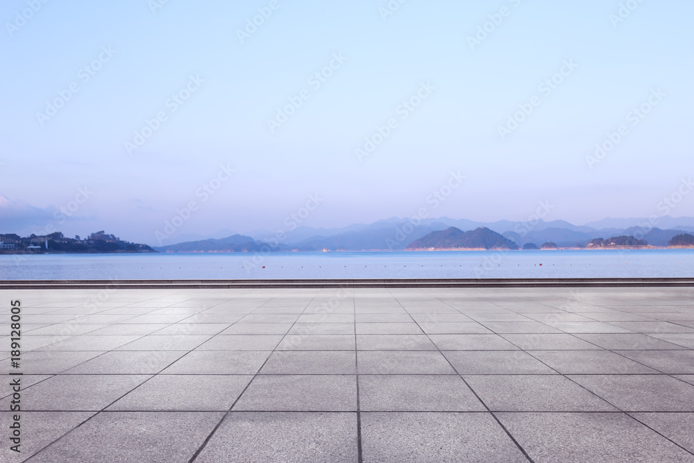 empty marble floor with beautiful lake