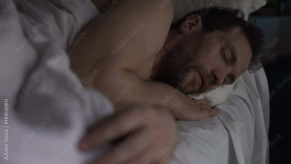 Tipsy male having sound sleep on sofa bed, breathing with open mouth, recovery Tipsy male having sound sleep on sofa bed, breathing with open mouth, recovery