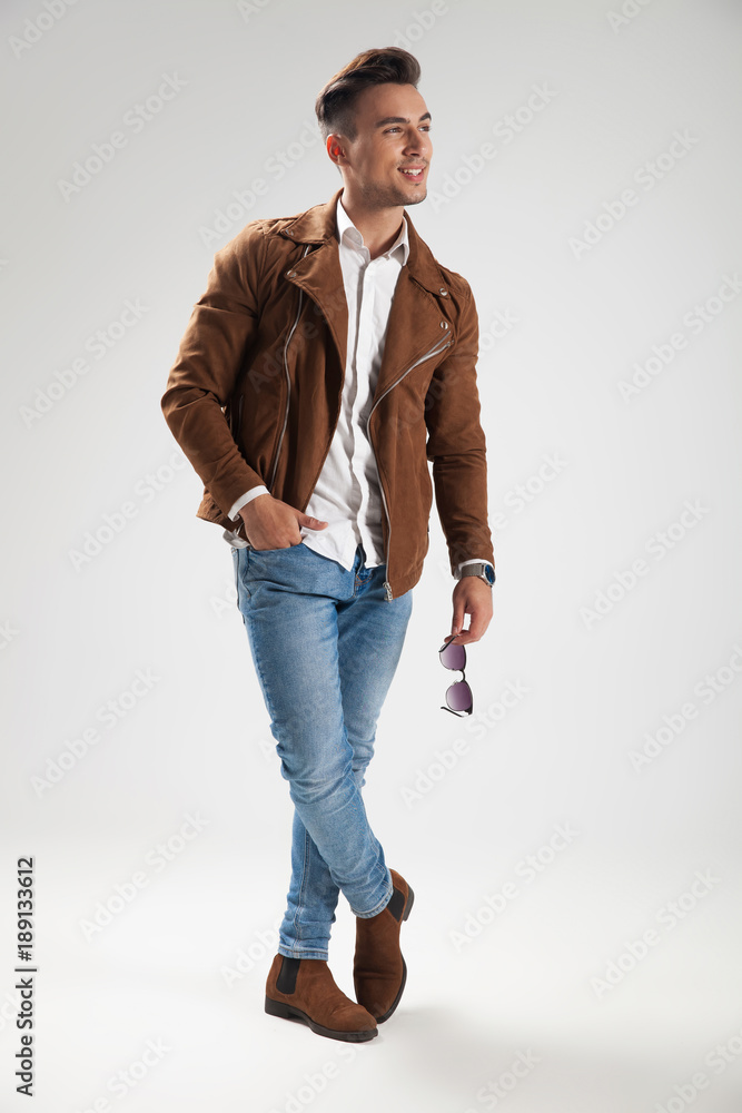 relaxed laughing casual man standing in studio relaxed laughing casual man standing in studio
