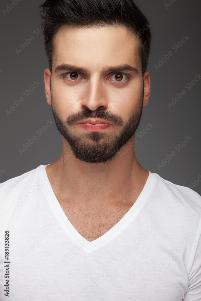 Fototapeta premium young man blowing cheeks