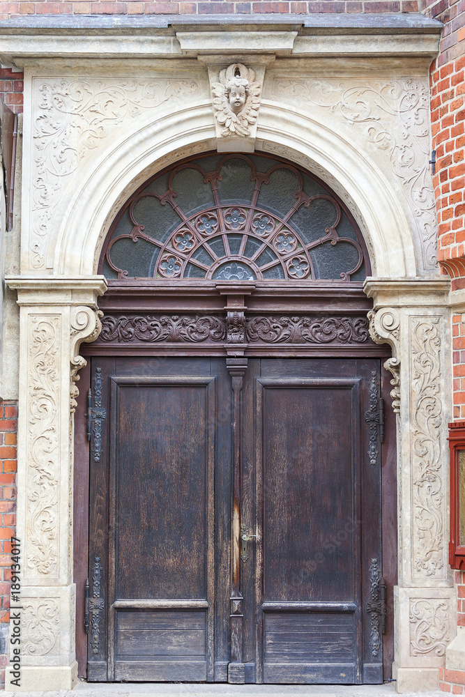 14th century gothic St. Elisabeth Church, wooden door, Market Square, Wroclaw, Poland.