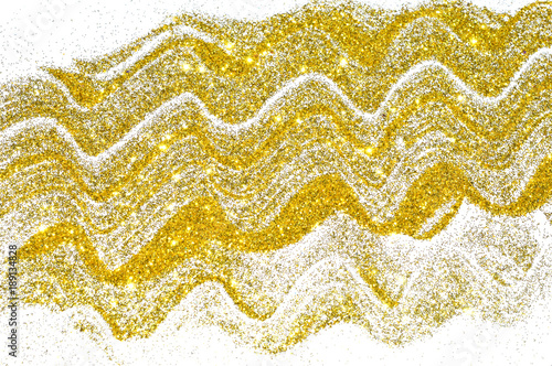 Abstract wavy laces of golden glitter sparkles on white background, decorative sequins for your design