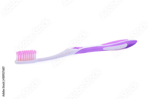 new purple toothbrush isolated on white background