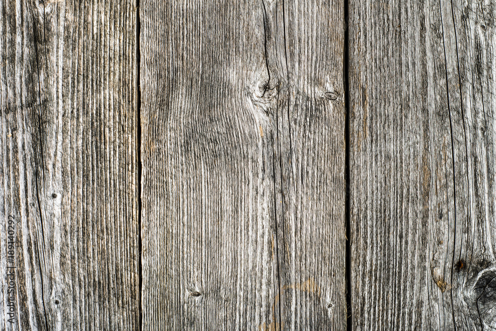 Old wooden background, grunge surface of gray boards..