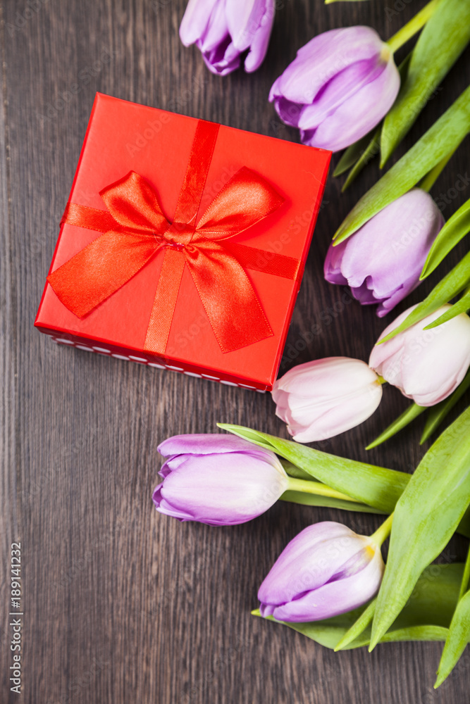 Bouquet of tulips and a gift