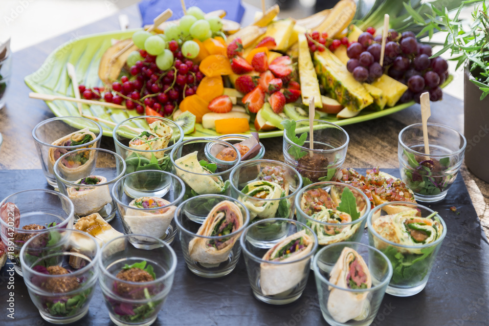 Bruschetta with vegetables, pancakes with salmon, fresh fruits Bruschetta with vegetables, pancakes with salmon, fresh fruits