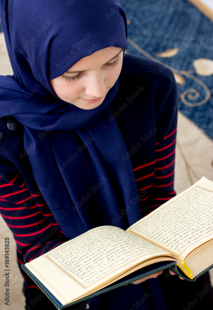 Young muslim girl with Qoran Young muslim girl with Qoran