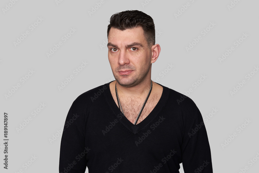 Fototapeta premium Handsome man portrait isolated on grey