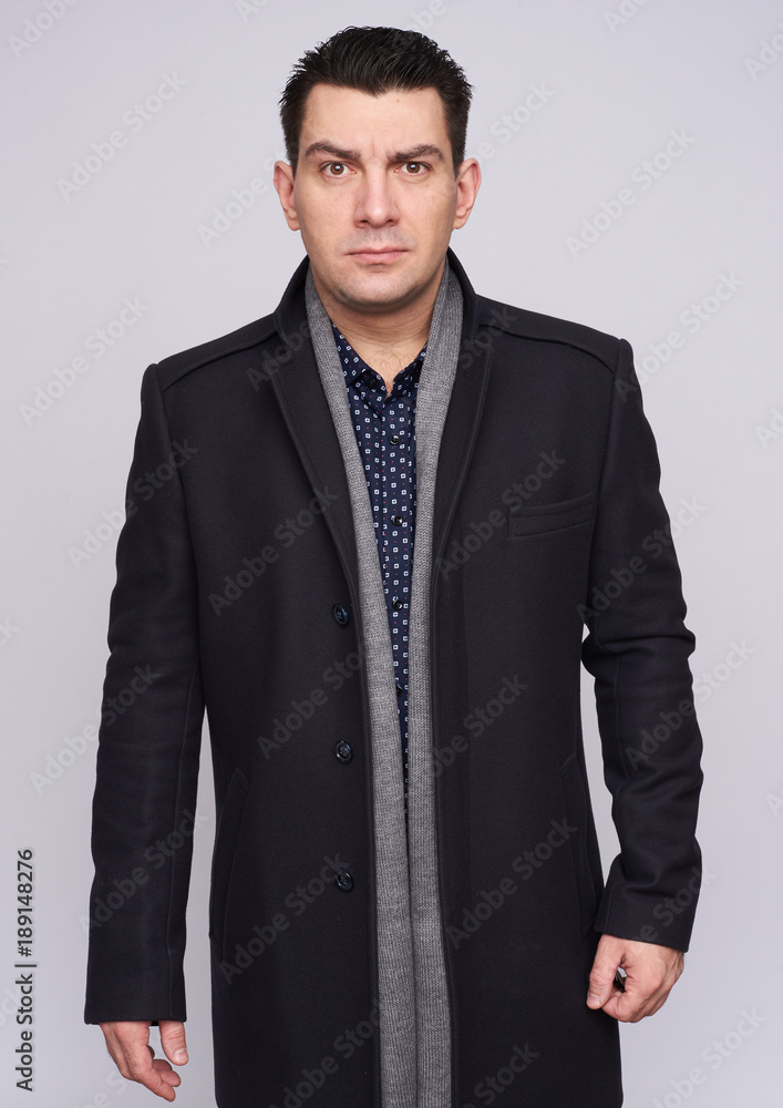 Fototapeta premium Serious man wearing coat. isolated