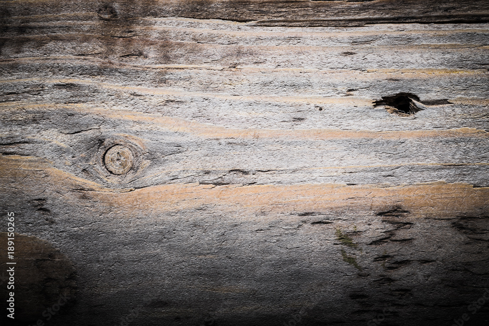 Naklejka premium Rough weathered wooden board. Rustic texture for background. Toned