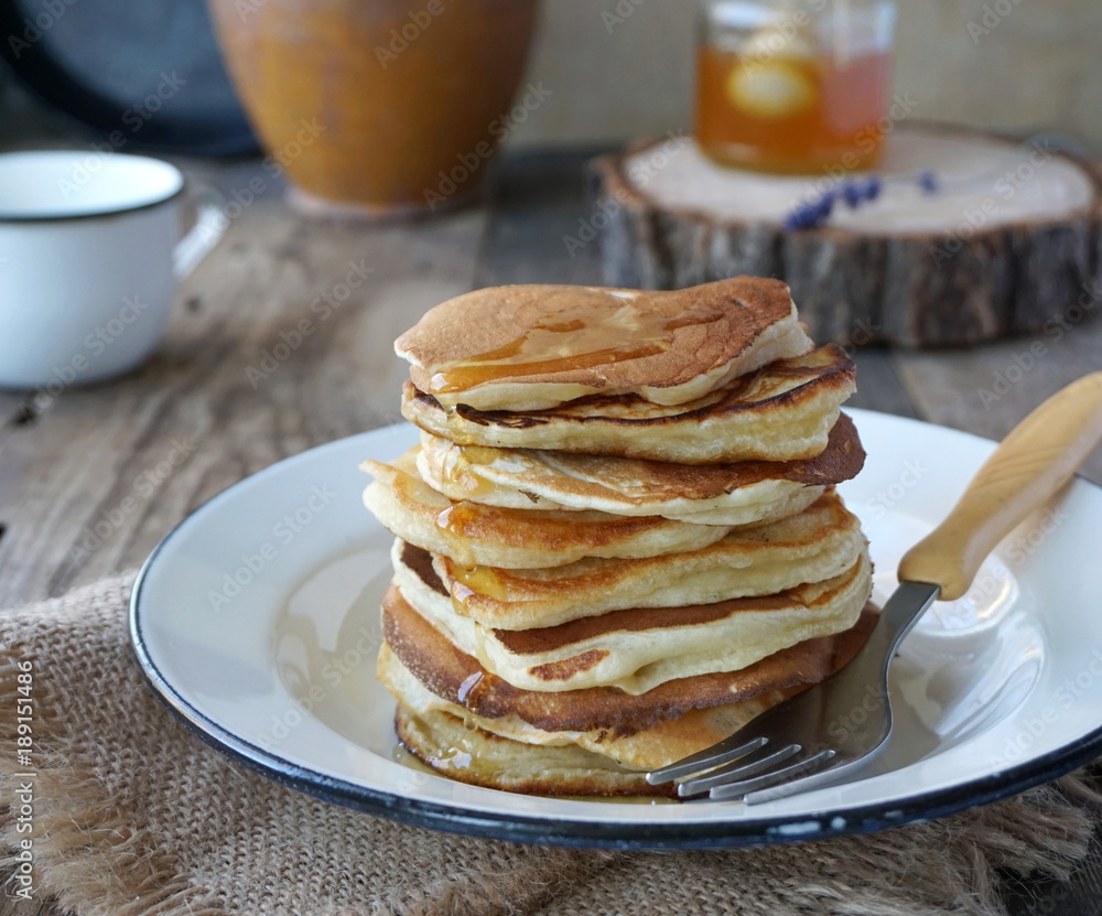 Pancakes with honey in a plate Pancakes with honey in a plate