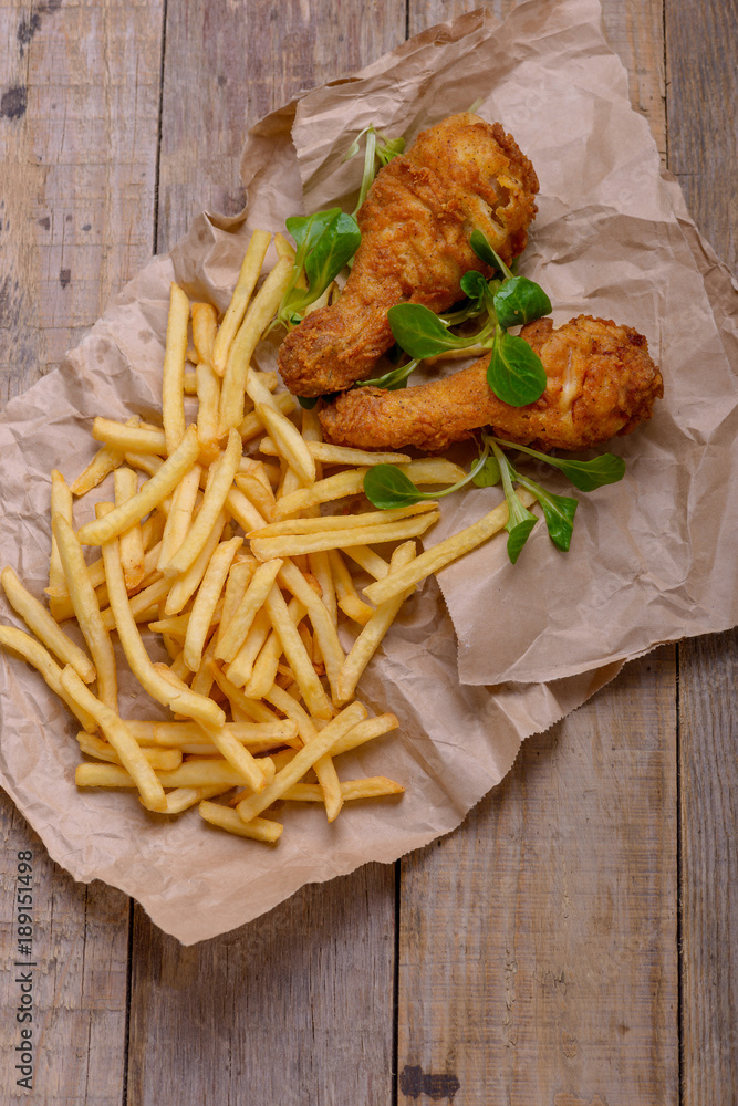 Crispy chicken legs and french fries Crispy chicken legs and french fries