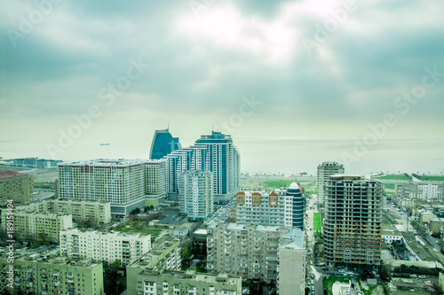 City view skyscrapers with dramatic cloudy sky background. photo
