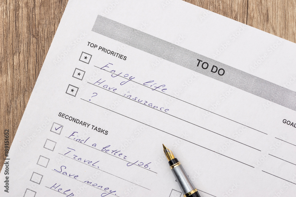 to do list with pen on desk to do list with pen on desk
