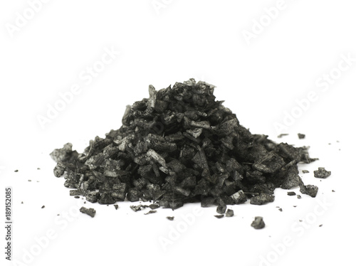 Pile of black salt crystals isolated