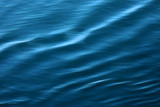 Vivid blue rippling ocean, captured with a sense of movement