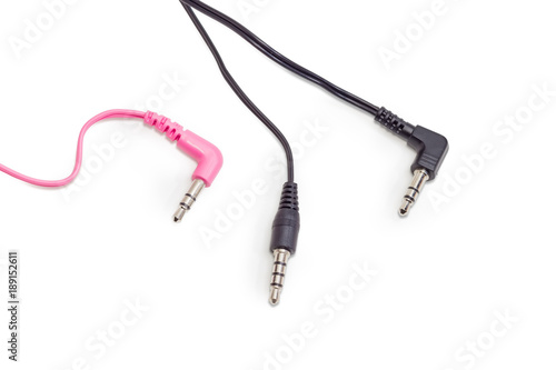 Three different audio plugs with parts of cables