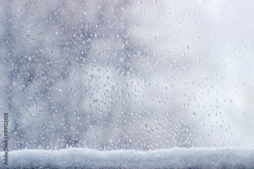 Background of the window pane during a sleet