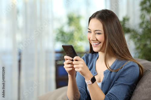 Woman wearing a smartwatch using a mobile phone