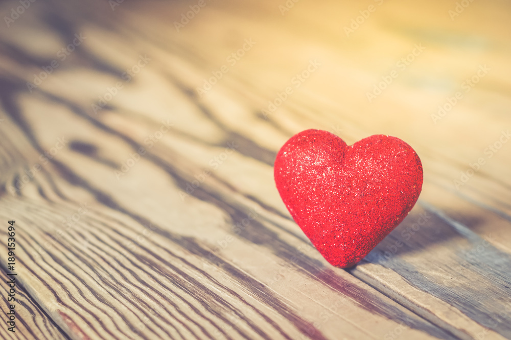 Red heart with glitter on wood Red heart with glitter on wood