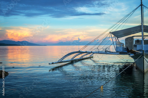 Banka  traditional filipino fishing boat at sunset  Cebu island  The Philippines