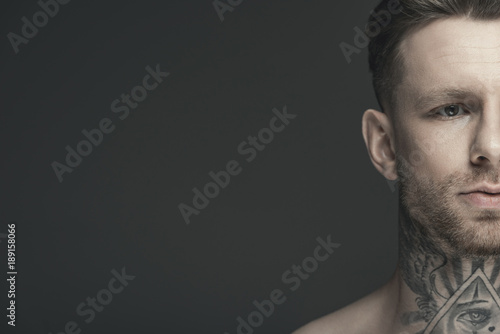 Fototapeta Naklejka Na Ścianę i Meble -  cropped view of young tattooed man, isolated on grey