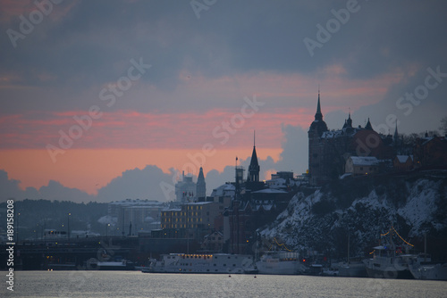 Colourful sunrise over Stockholm waterfront at winter in a cold morning photo
