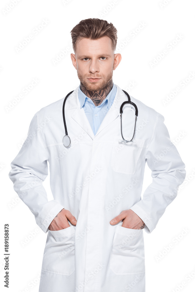 professional doctor with stethoscope and hands in pockets of white coat, isolated on white professional doctor with stethoscope and hands in pockets of white coat, isolated on white