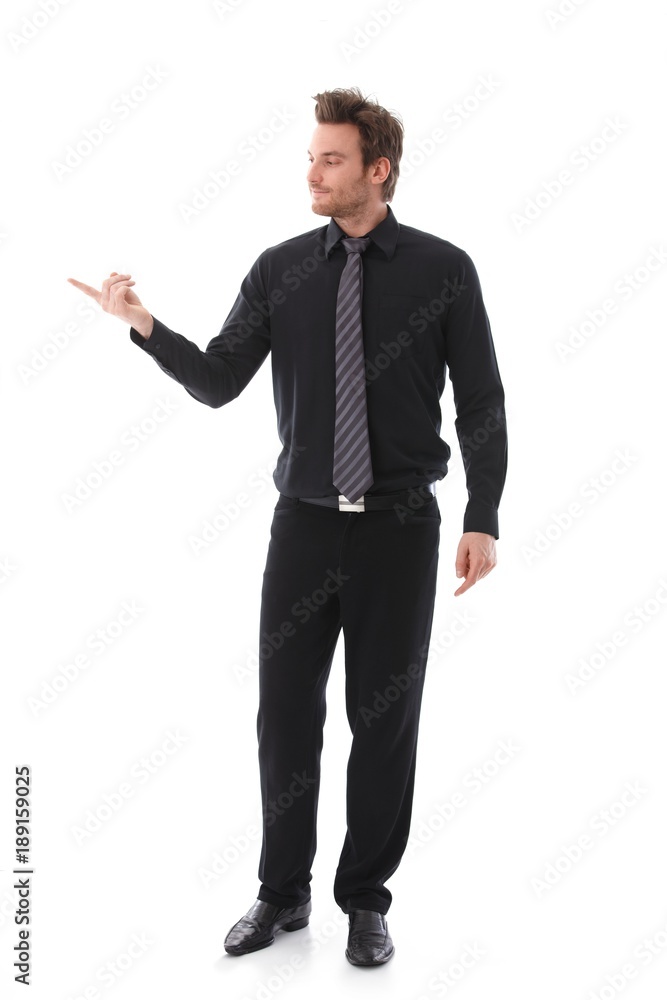 Businessman balancing sg on forefinger Businessman balancing sg on forefinger