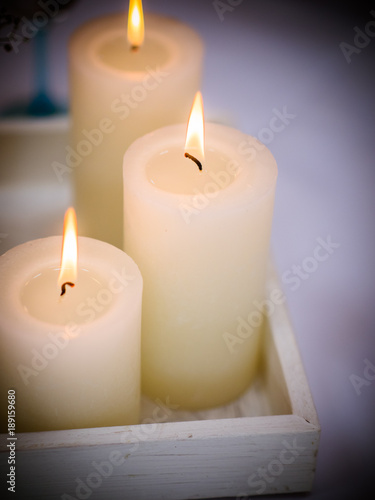 Burning candles set. Aromatic decorative round cylindrical candle sticks with burning flames