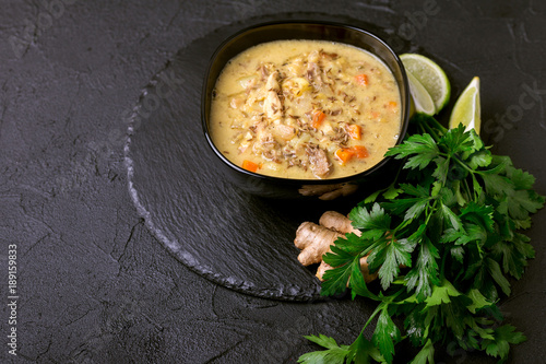 Indian Mulligatawny soup with lentil, parsley. Copyspace, horizontal view.