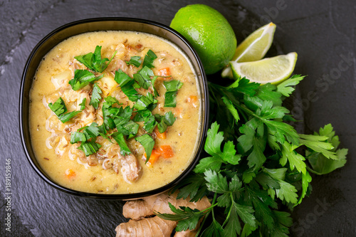 Indian Mulligatawny soup with lentil, parsley. Copyspace, top view. photo