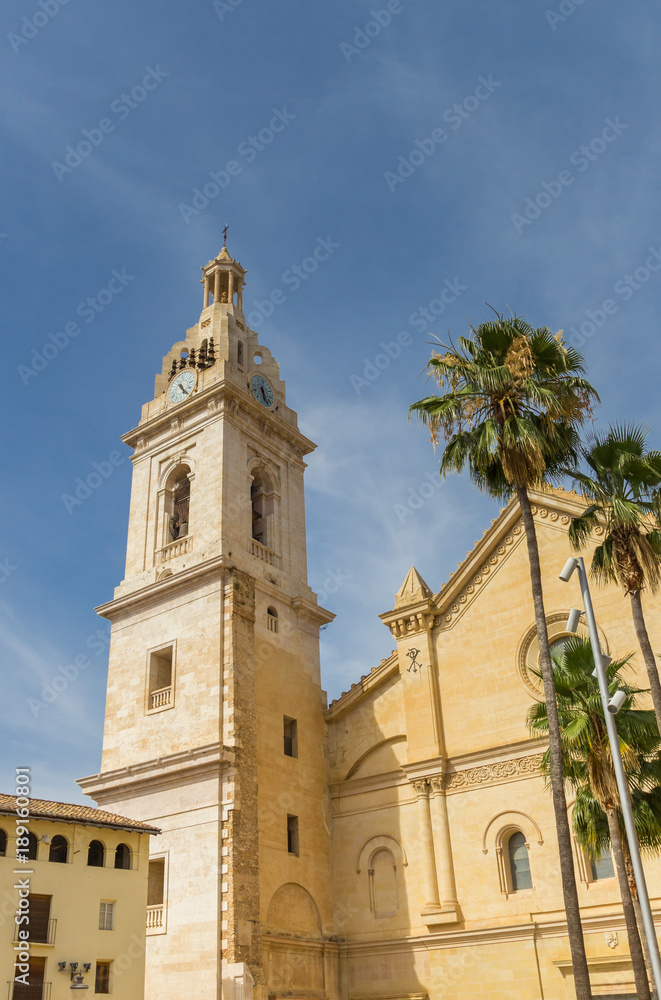 Church tower and palm trees in Xativa