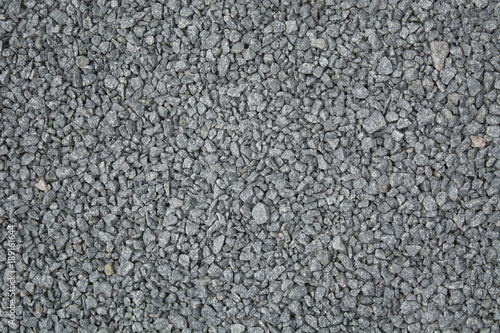 Grey small gravel textured road background