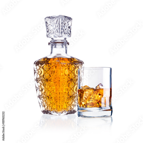 bottle and glass of whisky isolated on white