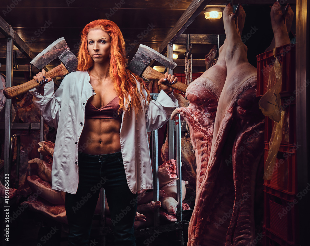 Redhead female in a meat factory. Redhead female in a meat factory.