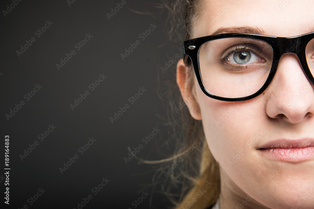 Close-up of attractive female doctor half face Close-up of attractive female doctor half face