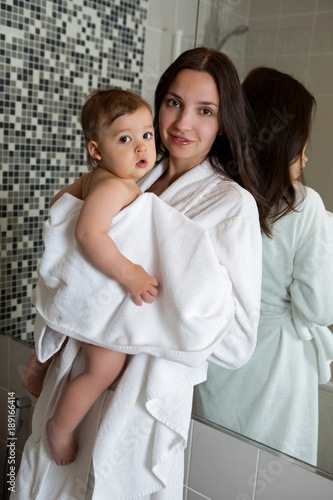 mother in a Bathrobe and with a child