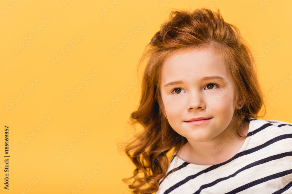 portrait of pretty kid looking away isolated on yellow portrait of pretty kid looking away isolated on yellow