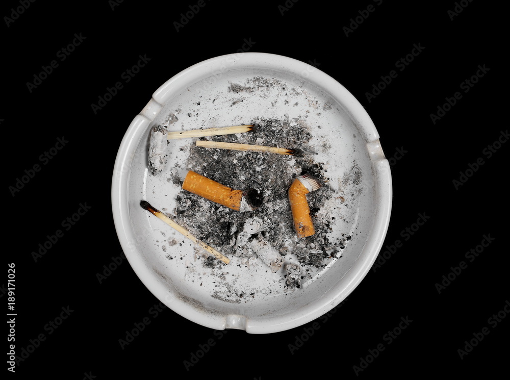 Cigarette stubs, matches and ash in ashtray isolated on white background, top view Cigarette stubs, matches and ash in ashtray isolated on white background, top view