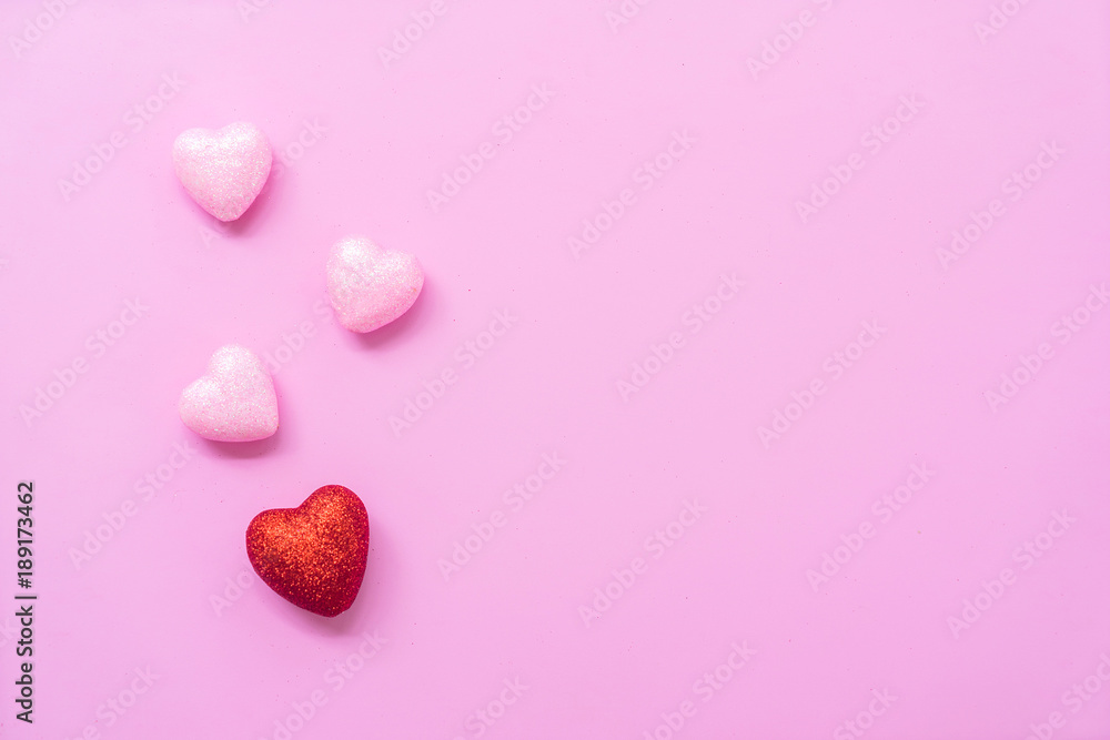 The 14th of February. St. Valentine's Day. Background with fluffy pink and red hearts on a pink background. Top view with copy space