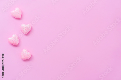 The 14th of February. St. Valentine's Day. Background with pink hearts on a pink background. Top view with copy space