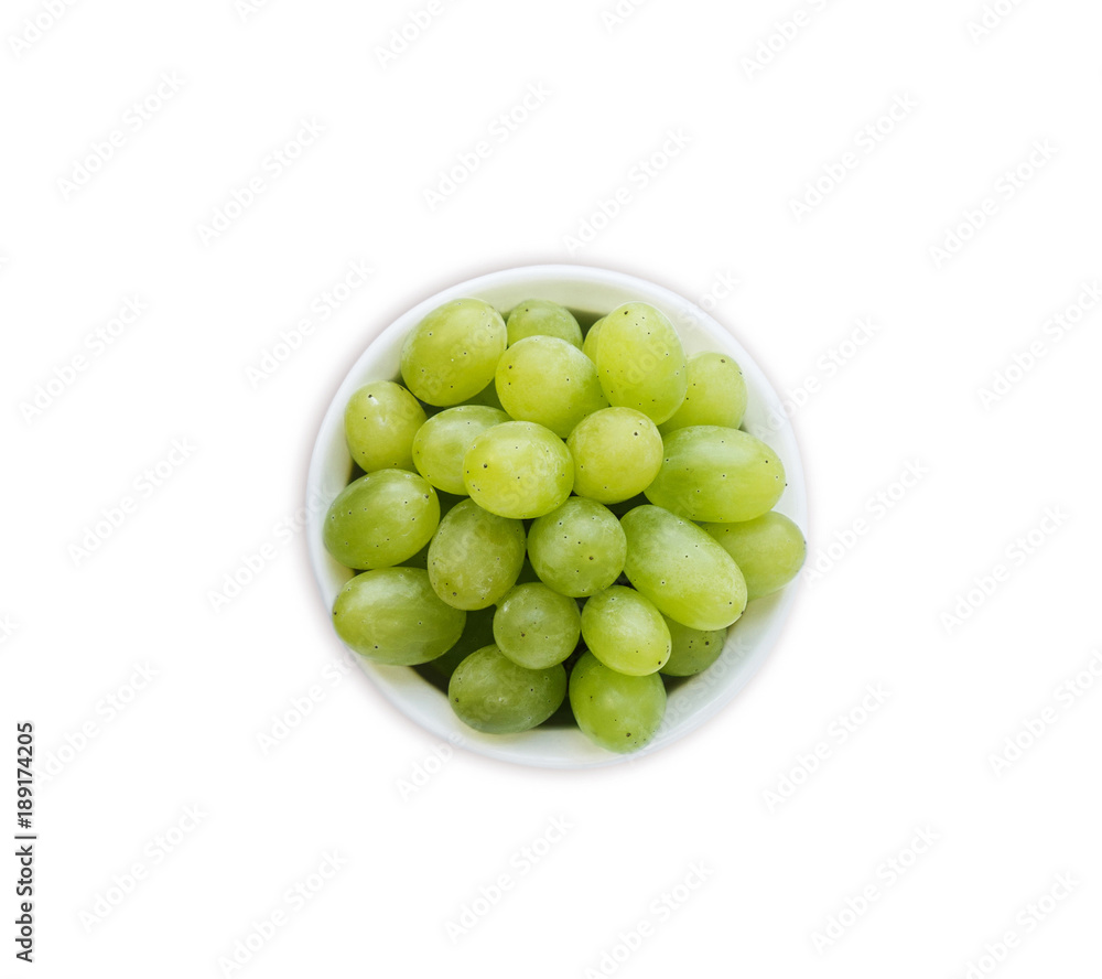Grapes in a bowl isolated on white background. Green grapes Kish Mish. Vegetarian or healthy eating. Top view. Grapes in a bowl isolated on white background. Green grapes Kish Mish. Vegetarian or healthy eating. Top view.